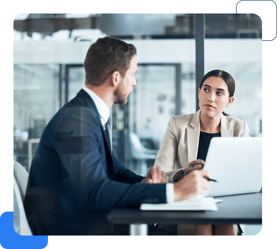 Business meeting with two professionals discussing strategy.