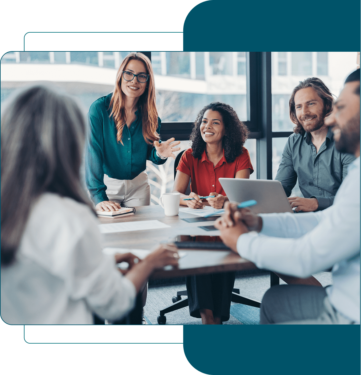 A diverse group of professionals collaborating in a modern office meeting.