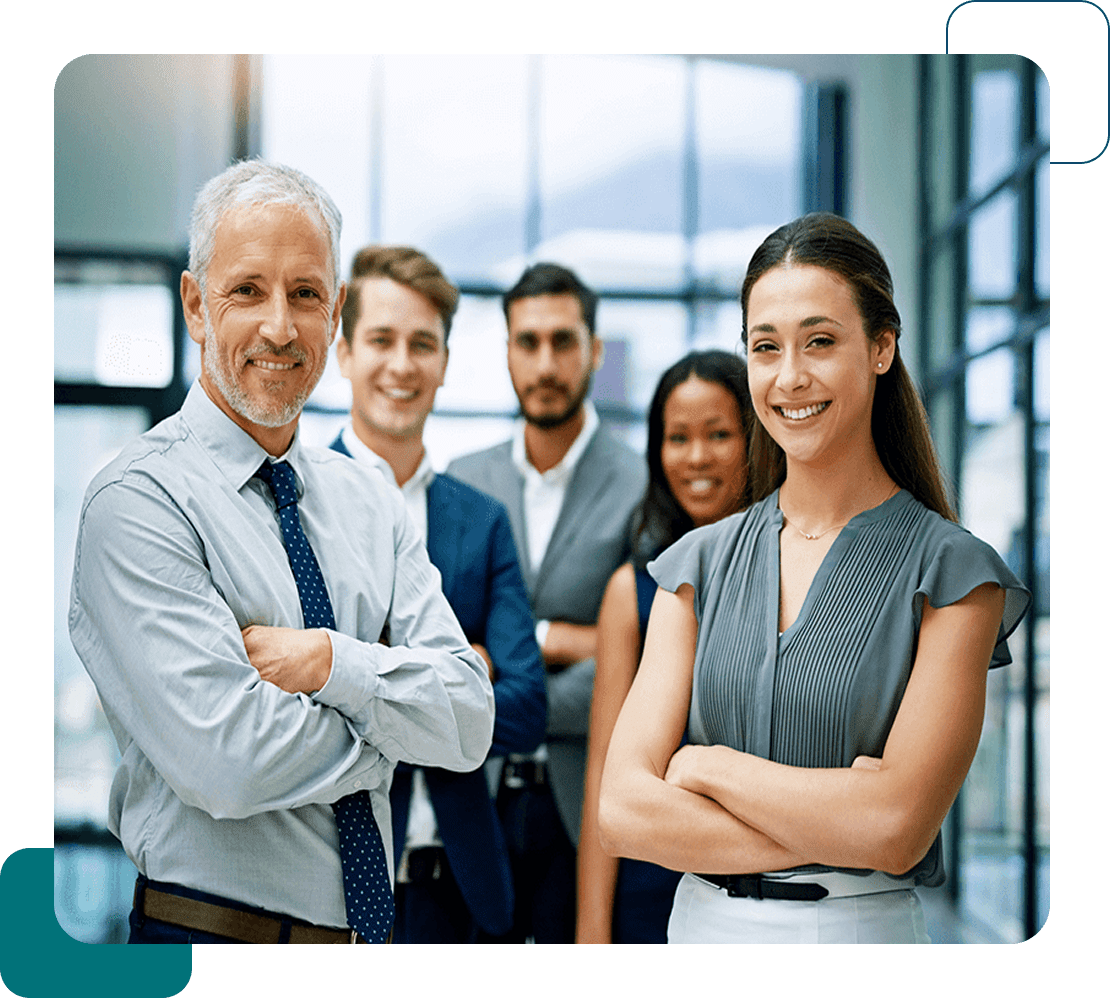 A confident business team posing together in an office.